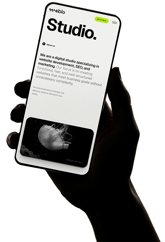 Hand holding phone demonstrating Weblo Digital ecosystem
